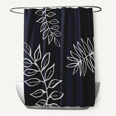 a black shower curtain with white leaves on it