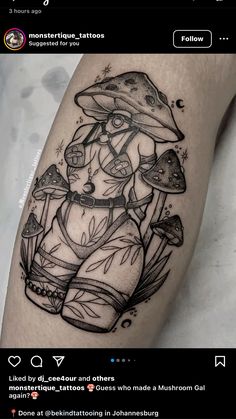 a black and white tattoo with an image of a woman holding mushrooms on her leg