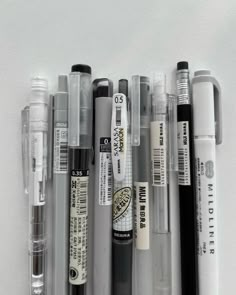 several different types of pens are lined up together