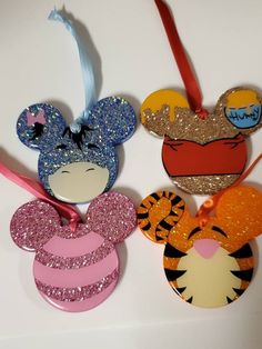 three mickey mouse ornament hanging on a wall