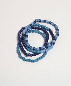 Set of 4 4mm seed bead Three shades of blue Great worn with blue jeans Stretchy If you would like any other size than what is listed please message me. Blue Beaded Bracelets With Tiny Beads For Everyday, Casual Blue Jewelry With Tiny Beads, Casual Blue Bracelet With Spacer Beads, Casual Blue Bracelets With Spacer Beads, Casual Blue Beaded Bracelets With Spacer Beads, Handmade Blue Beaded Bracelets For Everyday, Adjustable Blue Beaded Bracelets With Wooden Beads, Casual Handmade Blue Beaded Bracelets, Everyday Blue Beaded Bracelets With Tiny Beads