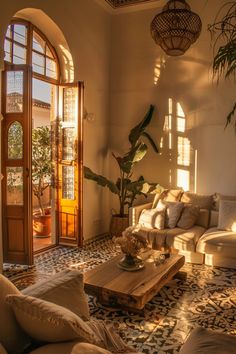 a living room filled with lots of furniture next to a tall potted palm tree