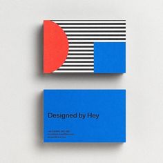 two business cards designed by hey with blue, red and black stripes on them sitting next to each other