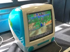 an old computer sitting on top of a desk