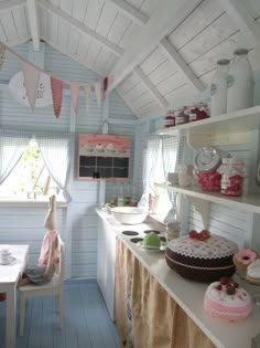 a kitchen filled with lots of cakes and cupcakes