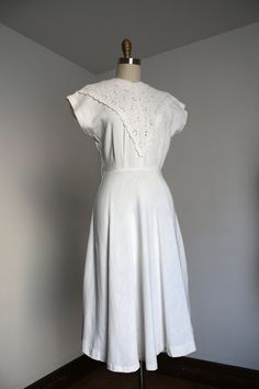 "STUNNING white dress from the 1940s. This dress features an eyelet lace front and a cotton or rayon cotton style fabric on the rest. Metal zipper.  Label: Dayton's Vancouver  Measurements: { xsmall } Bust: 34\"  Waist: 25\"  Hips: relatively open (bias cut) Length: 43\" Condition: excellent vintage condition with minor signs of wear - sold as found. washed and ready to wear  ☆Shop☆ http://www.trunkofdresses.com/" White Cotton 1950s Style Dress, 1950s White Cotton Dress, 1950s White Vintage Summer Dress, 1950s Style White Vintage Summer Dress, White 1950s Vintage Summer Dress, 1950s Style White Daywear Dresses, 1960s Mini Dress, Eyelet Lace Dress, Vintage Style Dresses