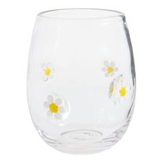 a clear glass with yellow and white flowers on it