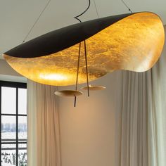 an unusual light fixture hangs from the ceiling