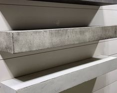 two concrete shelves sitting next to each other