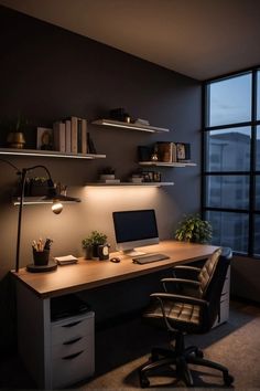 an office desk with a computer on top of it in front of a large window