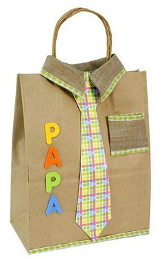 a paper bag with the word papa on it and a tie hanging out of it