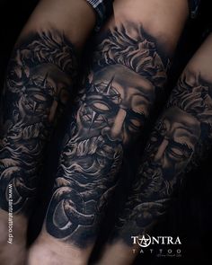 three men's arms with tattoos on them, one has a face and the other has