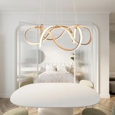 a white dining room table with chairs and a round light fixture hanging from the ceiling