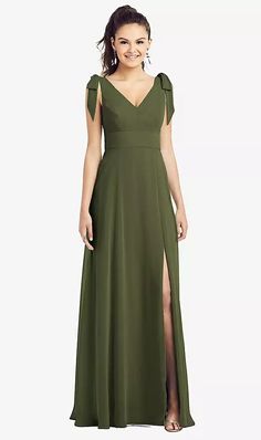 a woman in a long green dress