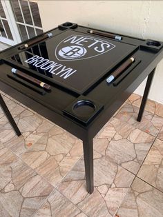 a table that has some kind of game on it with the words brooklyn nets written on it