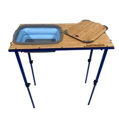 a wooden table with a blue tray on it and legs that are attached to the top