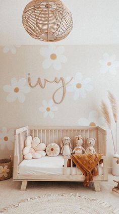 a baby's room with a white crib and gold polka dot wallpaper