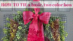 a red bow on top of a wreath with words how to tie a basic two color bow