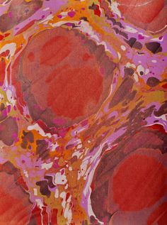 an abstract painting with red, orange and pink colors on it's surface is shown