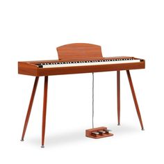 an electronic piano sitting on top of a wooden stand