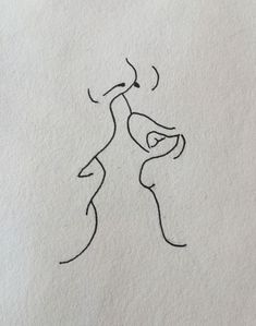 a drawing of two people kissing each other with one holding the other's hand