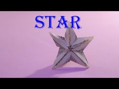 an origami star on a pink background with the words how to make a paper star