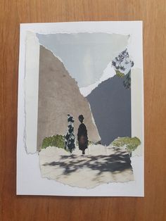 a piece of paper that has been altered to look like two people walking down a road