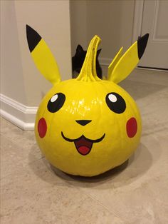 a pokemon pikachu pumpkin sitting on the floor