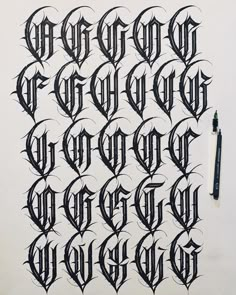 the letters and numbers are drawn in black ink on a sheet of paper with a marker