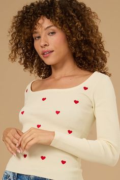 This sweet top is perfect for a casual day out. Its fitted silhouette and scattered heart embroidery make it both comfy and cute. Casual White Sweater With Heart Print, White Knit Sweater With Red Mini Hearts, White Embroidered Heart-shaped Top, White Dress Skirt, Casual Pink Heart-shaped Sweater, Trendy Heart-shaped Valentine's Day Sweater, Sweet Top, Christmas Skirt, Heart Embroidery