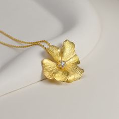 Peonies are known as the flower of riches and honor. With their lush, full, rounded bloom, peonies embody romance and prosperity and are regarded as an omen of good fortune and happy marriage. The peony pendant is meticulously handcrafted by our artists with high quality 925 sterling silver. The gold flower is 18K gold plated on 925 sterling silver. Size: approx. (W x L) 20 x 24mm • Handmade with love • Authentic 925 Sterling Silver • Natural Gemstones • Eco-friendly packaging • Great for Gift Necklace For Wedding, Silver Flower Necklace, Hair Accessories Pearl, Beauty Magic, Peony Flowers, Flower Pendant Necklace, Silver 925 Necklace, Pearl Gemstone, Wedding Anniversary Gift