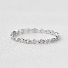 a white gold wedding band with diamonds