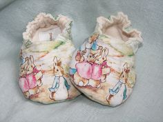 pair of baby shoes with bunnies on them