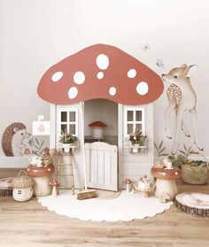 there is a doll house with mushrooms on the floor