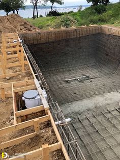 a construction site with concrete being poured into the ground