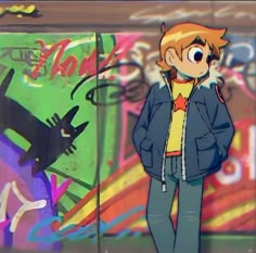 a young man standing in front of a graffiti covered wall