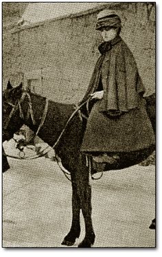 an old photo of a man riding on the back of a horse