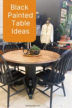 a black painted table with four chairs and a plant on it in front of an orange sign that says, black painted table ideas