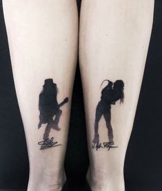 two people with tattoos on their legs, one has a guitar and the other has a hat