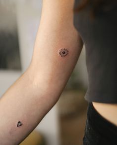 a woman with a small tattoo on her arm