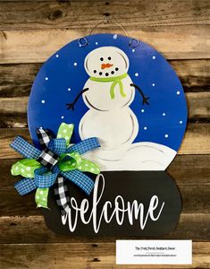 a welcome sign with a snowman on it