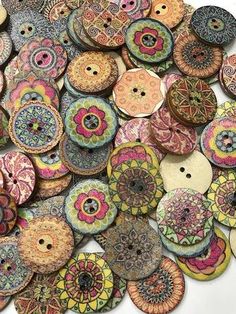 a pile of colorful buttons sitting on top of each other