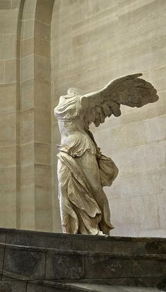 an angel statue in the middle of a building