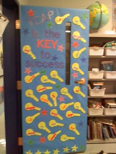 a classroom door decorated to look like the key to success is written on it in bright colors