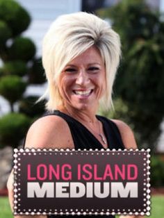 a woman holding a sign that says long island medium