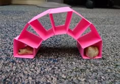 a pink object sitting on top of a carpet