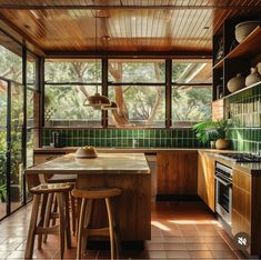 an image of a kitchen setting with green tile and wood accents on the walls, flooring and ceiling