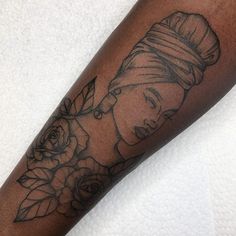 a woman's arm with a tattoo on it