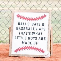 there is a sign that says balls, bats and baseball hats that's what little boys are made of