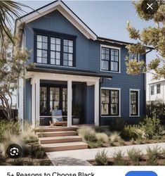 a blue house with white trim on the front and side windows, is featured in an instagram